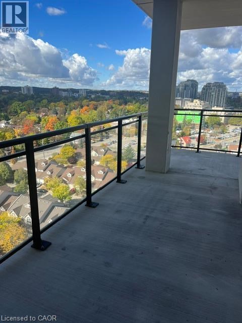 A balcony with a view of a city skyline.