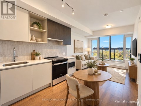 A modern kitchen with a dining table and chairs.