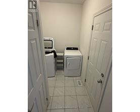 A laundry room with a washer and dryer.
