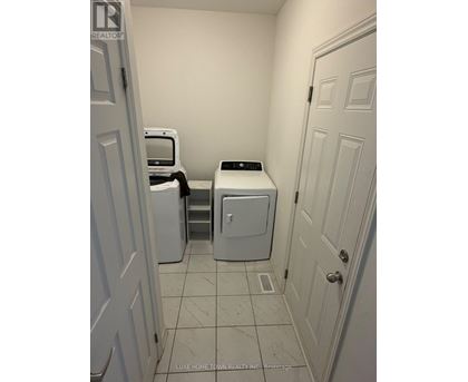 A laundry room with a washer and dryer.