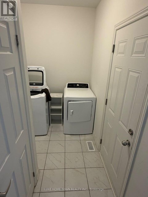 A laundry room with a washer and dryer.