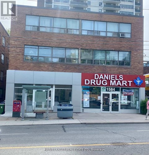 A Daniel's Drug Mart storefront with a sign that reads 1584.