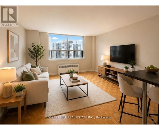 A living room with a couch, a coffee table, a television, and a window with a view of a cityscape.