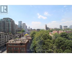 A cityscape with a Real One Realty building in the foreground.