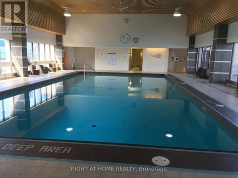 A swimming pool with the words "DEEP AREA" on the floor.