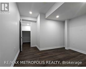 A room with a doorway leading to another room.