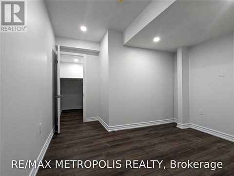 A room with a doorway leading to another room.