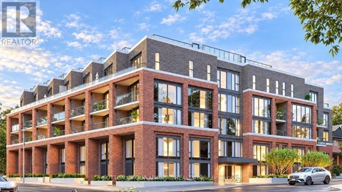 A modern apartment building with a car parked in front.