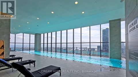 A brokerage office for Dream Home Realty Inc. has a pool with a view of the city.