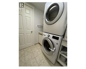 A washing machine in a laundry room.