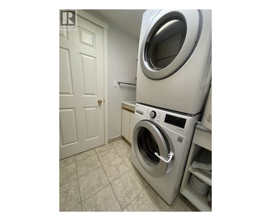 A washing machine in a laundry room.