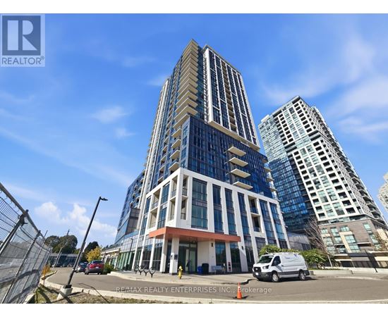 A tall building with a glass facade is the main focus of the image.