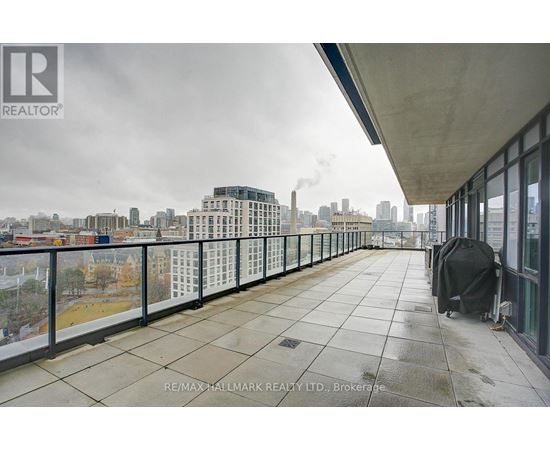 A balcony with a view of a city skyline.