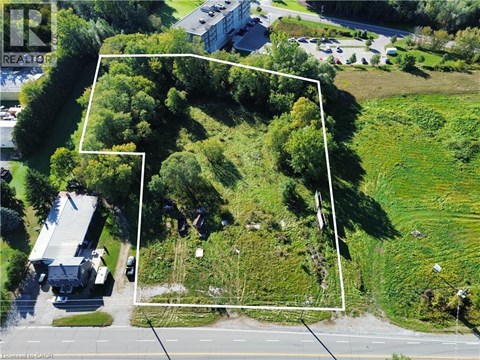 A bird's eye view of a property with a white line demarcating the boundary.