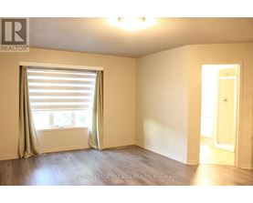 A room with a window and a door.