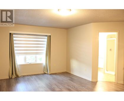 A room with a window and a door.