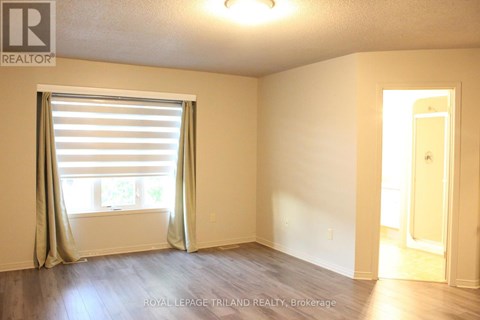 A room with a window and a door.