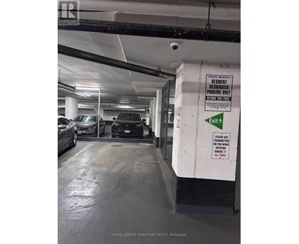 A white and black sign on a wall that says "Residential Parking Only".