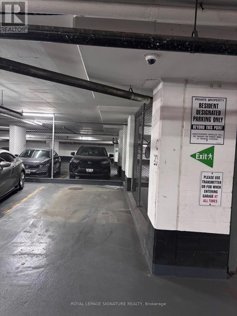 A white and black sign on a wall that says "Residential Parking Only".