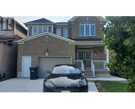 A house with a car parked in front of it.