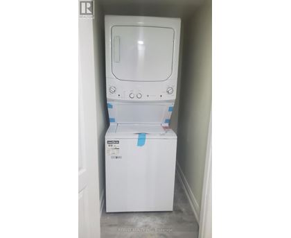 A white dishwasher is in a small space.