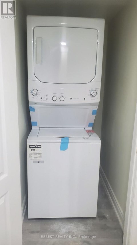 A white dishwasher is in a small space.