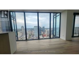 A real estate company's office with a view of the city skyline.