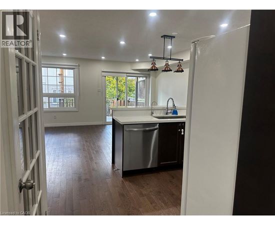 A kitchen with a sink and a dishwasher.