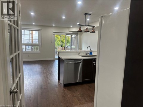 A kitchen with a sink and a dishwasher.