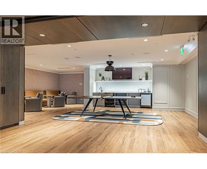 A conference room with a long table and chairs.