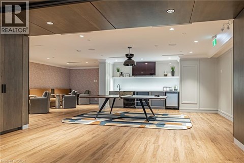 A conference room with a long table and chairs.