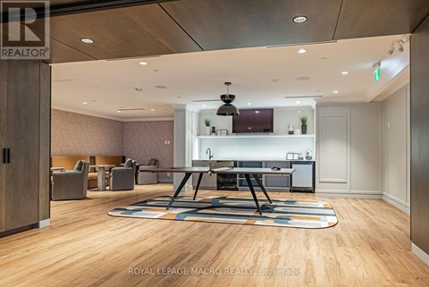 A modern office space with a long table and chairs.