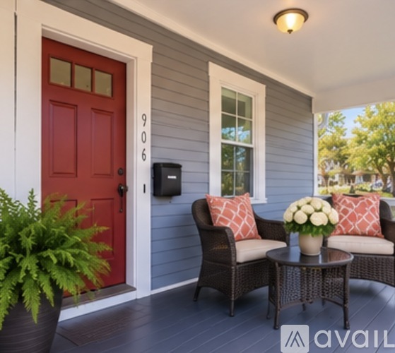 A red door with the number 906 on it.