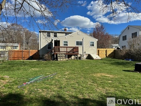 A house with a lawn in front of it.