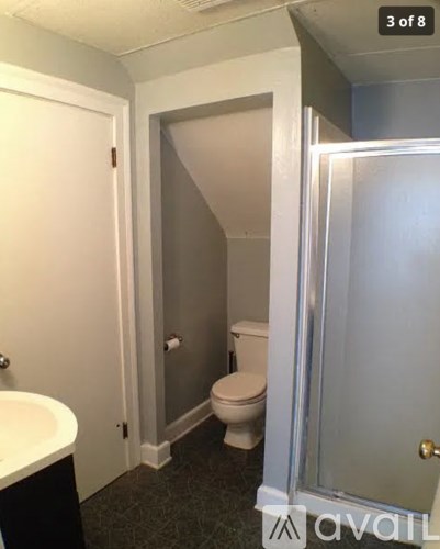 A bathroom with a toilet and sink.