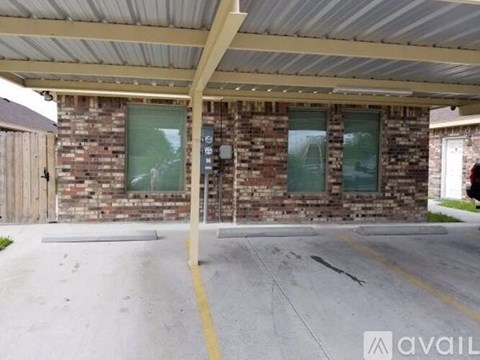 A parking lot with a building in the background.
