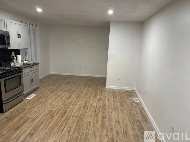 A kitchen with a stove top oven and a microwave.
