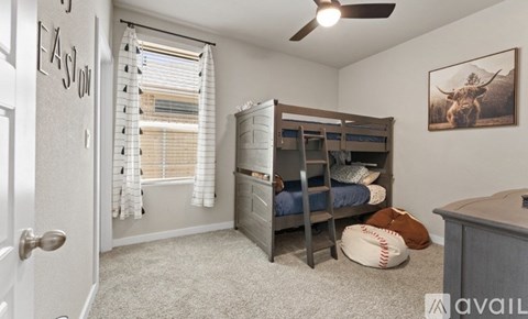 A bedroom with a bunk bed and a baseball themed picture on the wall.