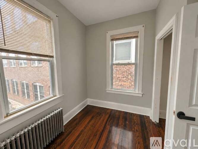 A room with a window and a door.