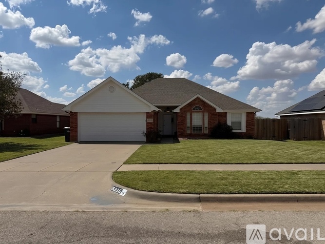 A house with a driveway in front of it.
