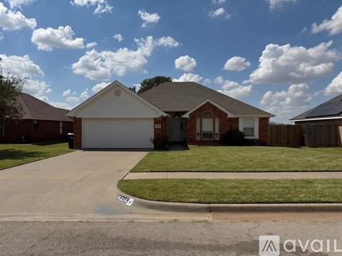 A house with a driveway in front of it.
