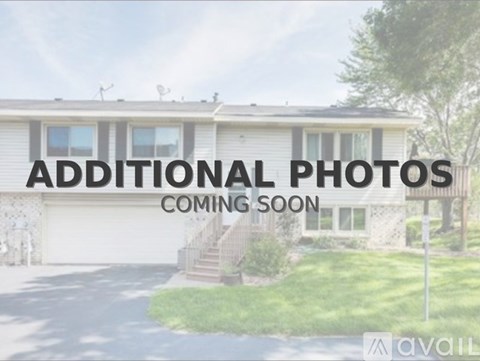 A house with the text "ADDITIONAL PHOTOS COMING SOON" across the top.