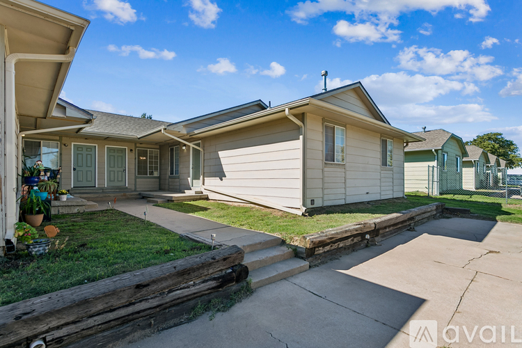 A sunny day at a residential area with houses and a clear sky.