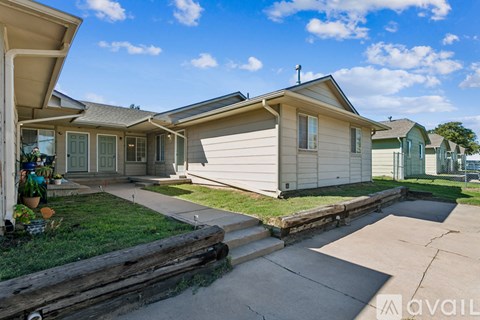 A sunny day at a residential area with houses and a clear sky.