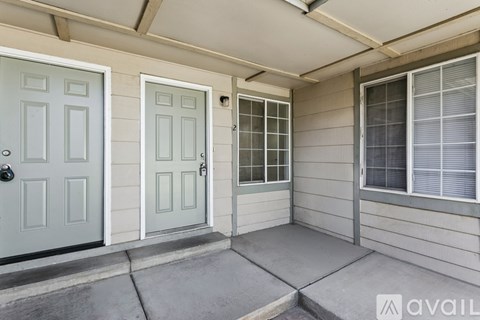 A house with a grey door and a glass window.