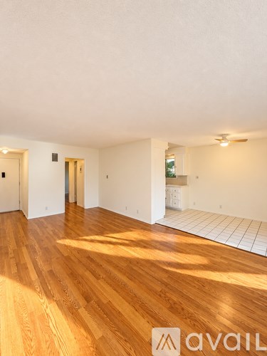 A room with wooden floors and white walls.