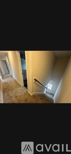 A staircase with a light on the side.