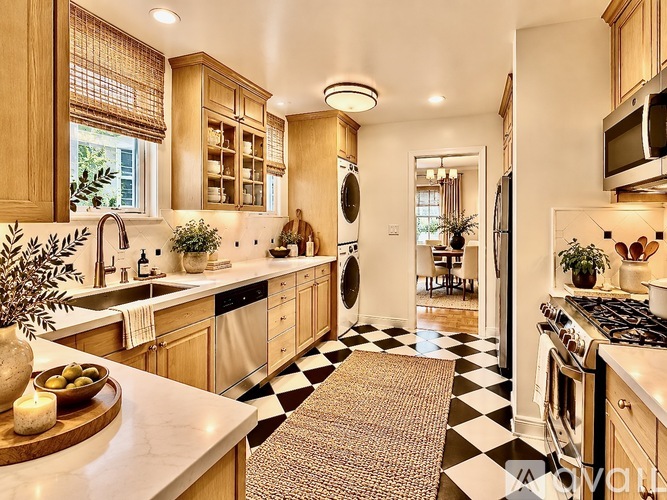 A kitchen with wooden cabinets and a black and white checkered floor.