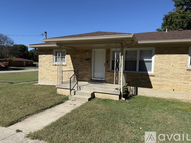 A house with a white door and a small porch.