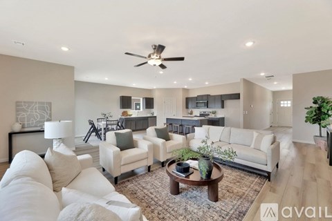 A living room with a white couch and a coffee table.